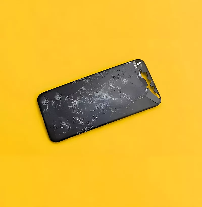 A cracked phone screen on yellow background