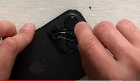 Chipping iPhone camera lens with tweezers